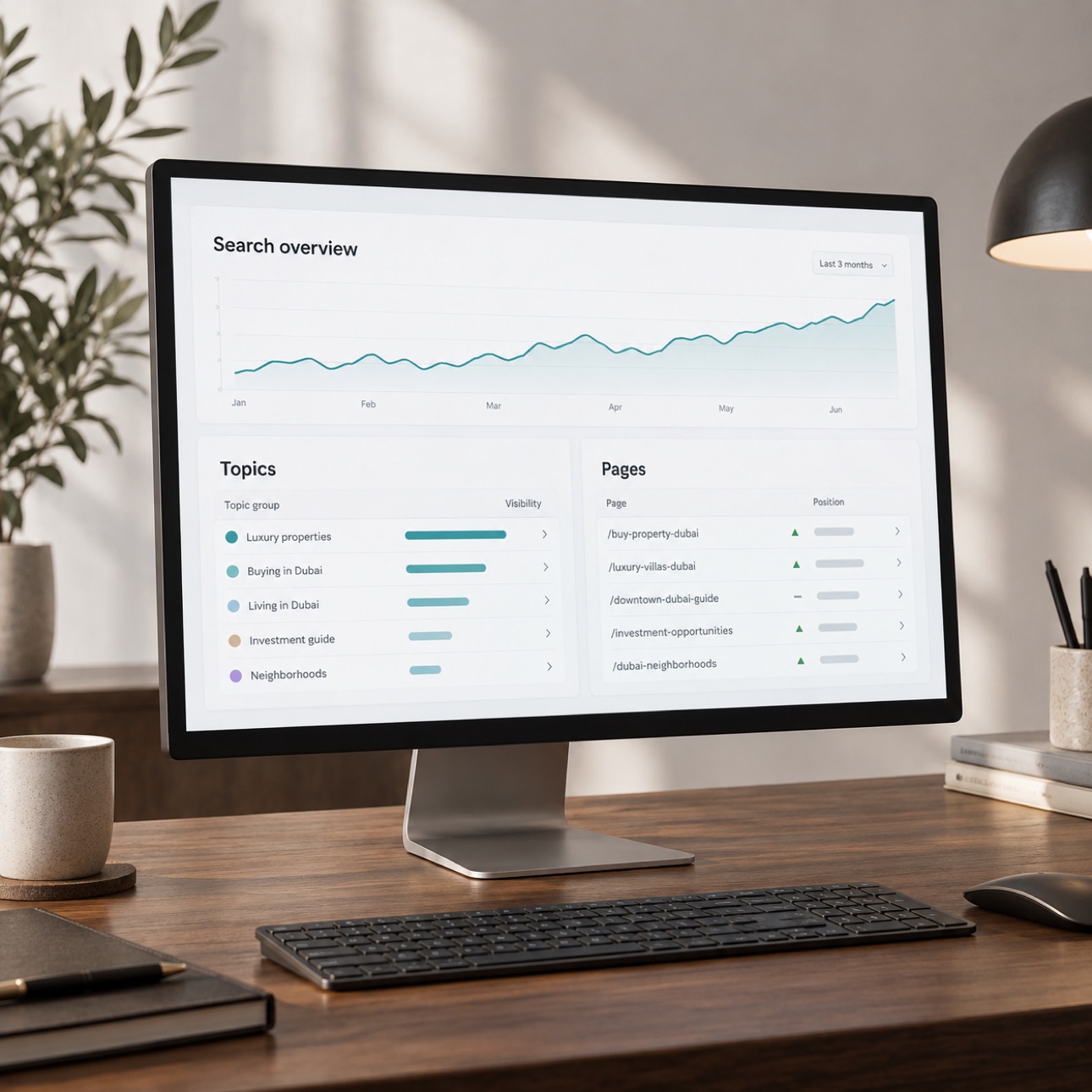 Monitor displaying an organic search overview on a dark walnut desk.